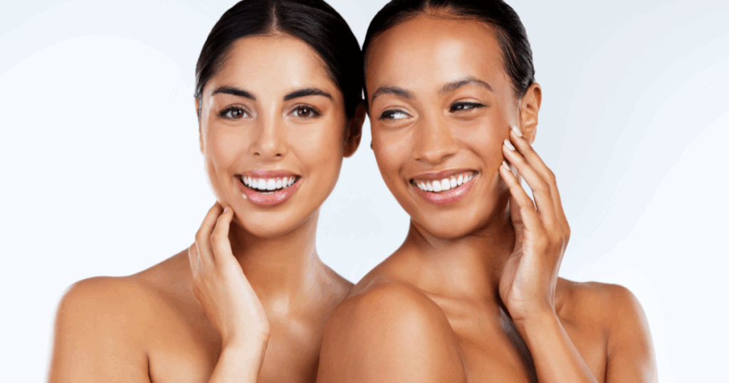 Two women with radiant skin after chemical peels, smiling and touching their faces