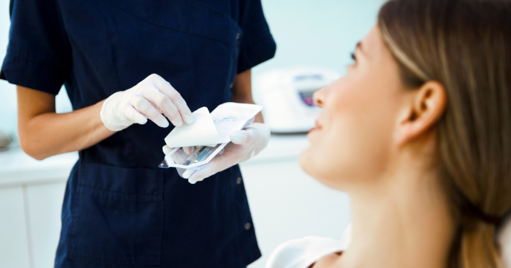 Medical aesthetic provider preparing injectables for a non-surgical facelift consultation in Las Vegas